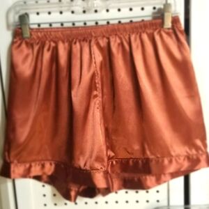 Brown silky shorts.